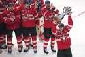 Canada captain Sidney Crosby, right, hoists the trophy after defeating the United States following …