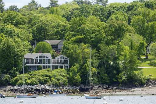 The homes of Lisa Gorman, front, and Amelia and Arthur Bond are seen, Tuesday, June 4, 2024, in Cam…