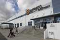 People leave the entrance to the Amazon San Bernardino Fulfillment Center, October 29, 2013 in San …