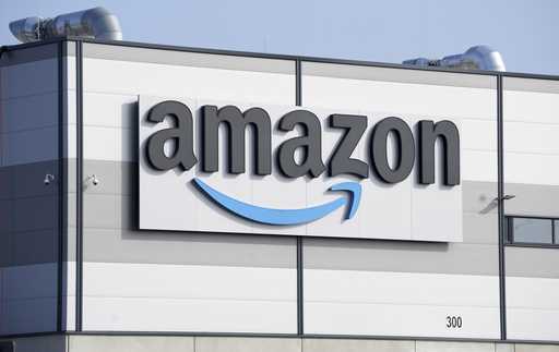 An Amazon company logo marks the facade of a building, March 18, 2022, in Schoenefeld near Berlin