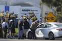 Amazon workers, on strike, picket outside an Amazon Fulfillment Center, Thursday, December 19, 2024…