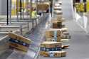 Amazon packages move along a conveyor at an Amazon warehouse facility, December 17, 2019, in Goodye…