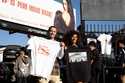 Van Tillian, left and Kapri Matlock pose for a photo with tee-shirts they got at a Pop-Up merchandi…