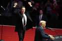 Elon Musk reacts as President-elect Donald Trump speaks at a rally ahead of the 60th Presidential I…