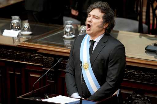 Argentina's President Javier Milei sings the national anthem as he addresses Congress to present th…