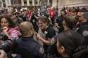 A pro-Israel protester screams at police officers while anti-Israel protesters occupy an area outsi…