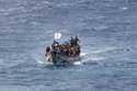 Migrants crowd a wooden boat as they sail to the port in La Restinga on the Canary island of El Hie…