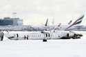 A Delta Air Lines plane lies upside down at Toronto Pearson Airport on Tuesday, February 18, 2025