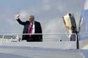 President Donald Trump, left, waves as he boards Air Force One with grandson Theodore, Ivanka Trump…