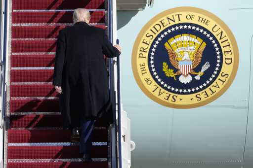 President Donald Trump boards Air Force One at Joint Base Andrews, Md