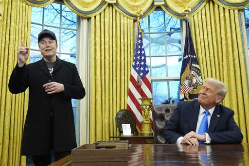 President Donald Trump listens as Elon Musk speaks in the Oval Office at the White House, Tuesday, …