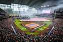 Smoke clears as the national anthem is played before the Houston Astros' season-opening baseball ga…