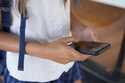 A teenage girl uses her phone to access social media in Sydney, Friday, November 8, 2024