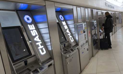 Chase Bank ATMs are shown, Thursday, March 25, 2021, in New York. (AP Photo/Mark Lennihan, File)
