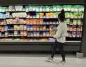 File - A shopper peruses cheese offerings at a Target store on October 4, 2023, in Sheridan, Colo