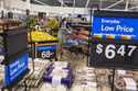 People buy groceries at a Walmart Superstore in Secaucus, New Jersey, July 11, 2024