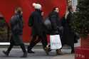 Shoppers walk along Fifth Avenue on November 29, 2024, in New York