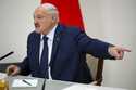 Belarusian President Alexander Lukashenko gestures while speaking to the media after voting in pres…