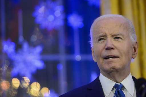 President Joe Biden speaks during a Hanukkah reception in the East Room of the White House in Washi…