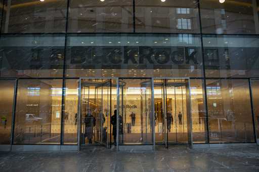 People walk in and out of the BlackRock investment company building in New York on March 14, 2023