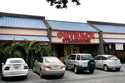 Vehicles are parked outside of an Outback Steakhouse restaurant, June 5, 2007, in Brandon, Fla