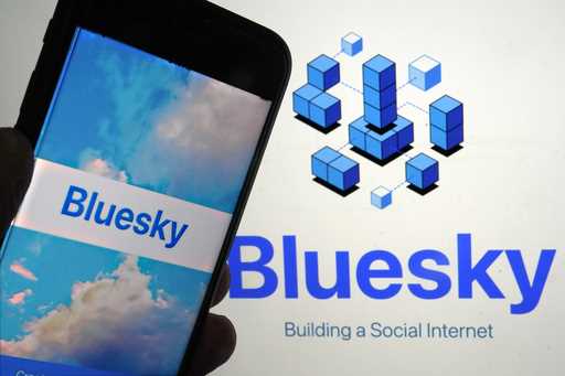 The app for Bluesky is shown on a mobile phone, left, and on a laptop screen on June 2, 2023, in Ne…