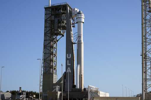 Boeing's Starliner capsule, atop an Atlas V rocket, sits on the launch pad at Space Launch Complex …