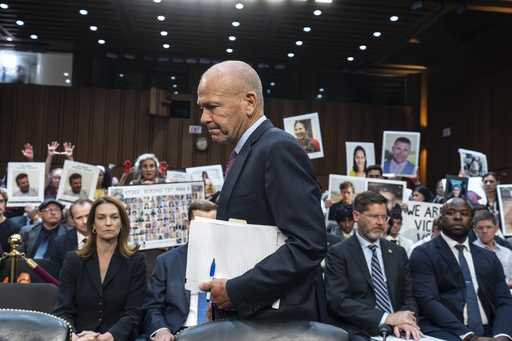 With protesters in the audience, Boeing CEO Dave Calhoun arrives at a Senate subcommittee hearing t…