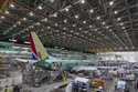 Boeing employees work on the 737 MAX on the final assembly line at Boeing's Renton plant, June 15, …