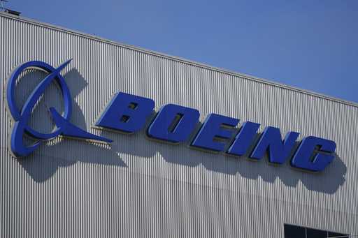 The Boeing logo is displayed at the company's factory Tuesday, Sept