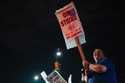 Machinist AJ Nelson, who has worked for Boeing for six years, works the picket line after union mem…