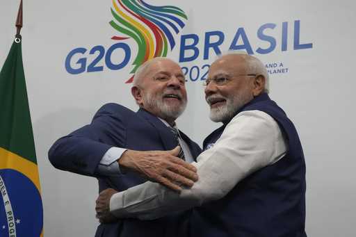 Brazil's President Luiz Inacio Lula da Silva, left, and India's Prime Minister Narendra Modi shake …