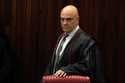 Brazilian Supreme Court Chief Justice Alexandre de Moraes arrives for a court hearing, in Brasilia,…