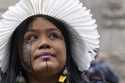 Wakrewa Krenak, from Brazil, stands outside the Royal Courts of Justice in London, Monday, October …