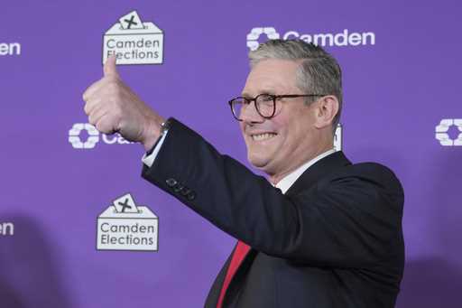 Britain's Labour Party leader Keir Starmer gives a thumbs up to his supporters after he was elected…