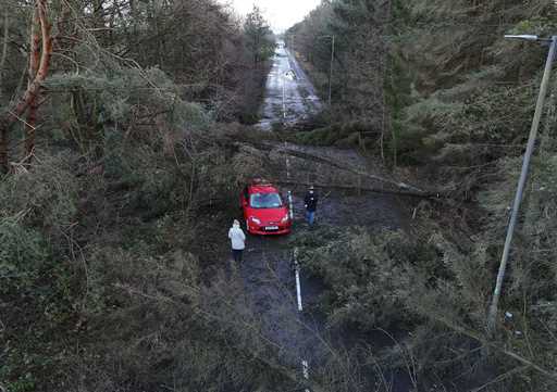 A car abandoned in Tryst Road in Larbert surrounded by fallen trees after Storm Eowyn, in Larbert, …