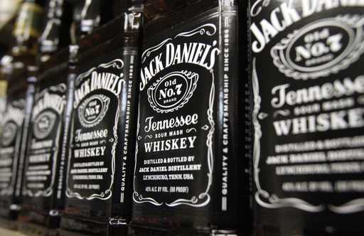 Bottles of Jack Daniel's Tennessee Whiskey line the shelves of a liquor outlet in Montpelier, Vt