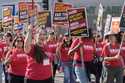 Mental health workers rally outside Kaiser Permanente Los Angeles Medical Center as they begin an o…