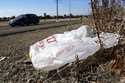 A plastic bag sits along a roadside in Sacramento, Calif