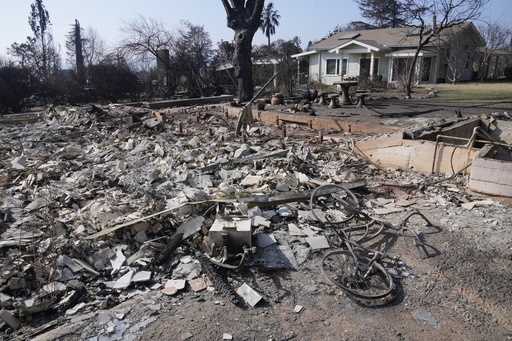 Debris from a destroyed home is seen as a newly built ADU…