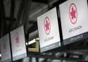 Air Canada check-in screens are seen at the Ottawa International Airport in Ottawa, Ontario, May 16…