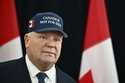 FILE-Ontario Premier Doug Ford, wearing a 'Canada Is Not For Sale' hat, speaks as he arrives for a …