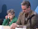 Lise Blais, widow of plaintiff Jean-Yves Blais, wipes her eye as her son, Martin, looks on during a…