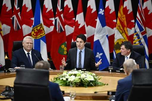 Canada Prime Minister Justin Trudeau makes his opening remarks as Ontario Premier Doug Ford, left, …