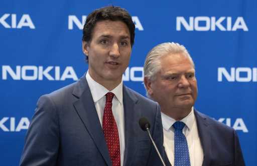 Prime Minister Justin Trudeau, left, responds to a question as Ontario Premier Doug Ford looks on f…