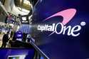 The logo for Capital One Financial is displayed above a trading post on the floor of the New York S…