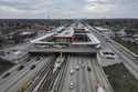 Cars pass the 95th Street Red Line Station, the train station currently the farthest south on the l…