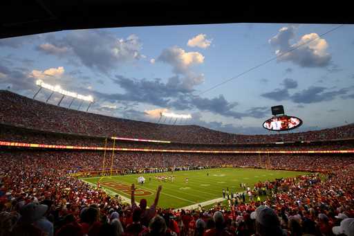 Fans cheer at Arrowhead Stadium during the first half of an NFL football game between the Kansas Ci…