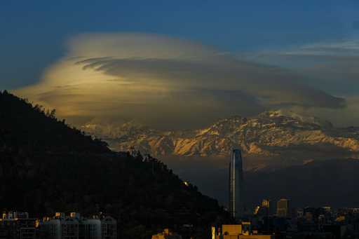 Clouds hover over the Andes Mountains in Santiago, Chile, June 19, 2024