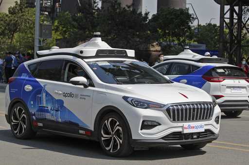 Baidu Apollo Robotaxis move on a street at the Shougang Park in Beijing, May 2, 2021